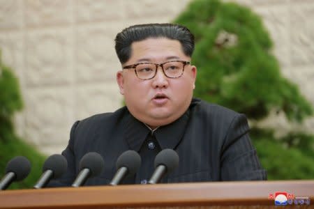 FILE PHOTO: North Korean leader Kim Jong Un speaks during the Third Plenary Meeting of the Seventh Central Committee of the Workers' Party of Korea (WPK), in this photo released by North Korea's Korean Central News Agency (KCNA) in Pyongyang on April 20, 2018. KCNA/via Reuters