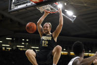 Purdue forward Evan Boudreaux dunks the ball during the first half of an NCAA college basketball game against Iowa, Tuesday, March 3, 2020, in Iowa City, Iowa. (AP Photo/Charlie Neibergall)