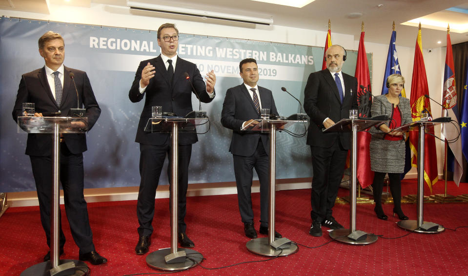 From left, Chairman of the Council of Ministers of Bosnia and Herzegovina Denis Zvizdic, Serbia's President Aleksandar Vucic, North Macedonia's Prime Minister Zoran Zaev, Albania's Prime Minister Edi Rama and Montenegro's Economy Minister Dragica Sekulic attend a joint news conference, following the Western Balkan leaders' meeting in the southwestern town of Ohrid, North Macedonia, Sunday, Nov. 10, 2019. Western Balkan leaders say they are committed to work closely and to remove administrative barriers for free movement of goods and people between their countries. (AP Photo/Boris Grdanoski)