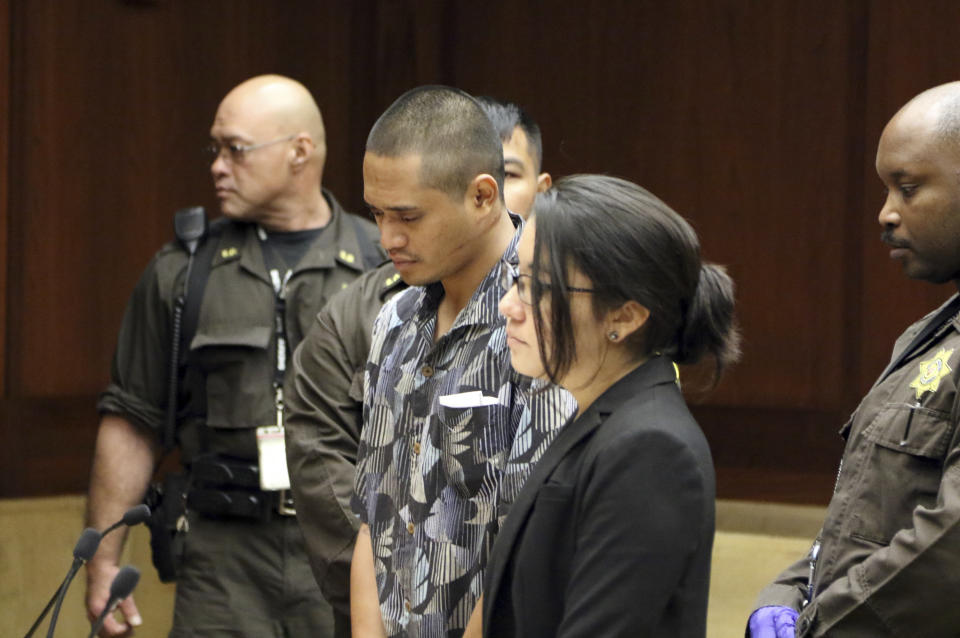 Alins Sumang stands next to Deputy Public Defender Sarah Nishioka in court Thursday, Jan. 31, 2019 in Honolulu. Prosecutors say Sumang recklessly caused the deaths of Casimir Pokorny of Pennsylvania, Reino Ikeda of Japan and William Lau of Honolulu. Police say speed and alcohol appeared to factors in Monday's crash. Police Chief Susan Ballard says it's one of Honolulu's deadliest pedestrian crashes. (AP Photo/Jennifer Sinco Kelleher).
