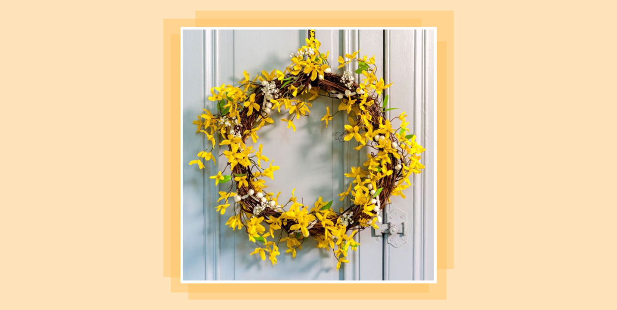 yellow wreath on white front door
