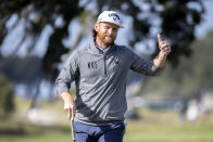 Tyler McCumber gives a thumbs-up to the crowd on the ninth hole after finishing 10-under par for the day during the final round of the RSM Classic golf tournament, Sunday, Nov. 21, 2021, in St. Simons Island, Ga. (AP Photo/Stephen B. Morton)