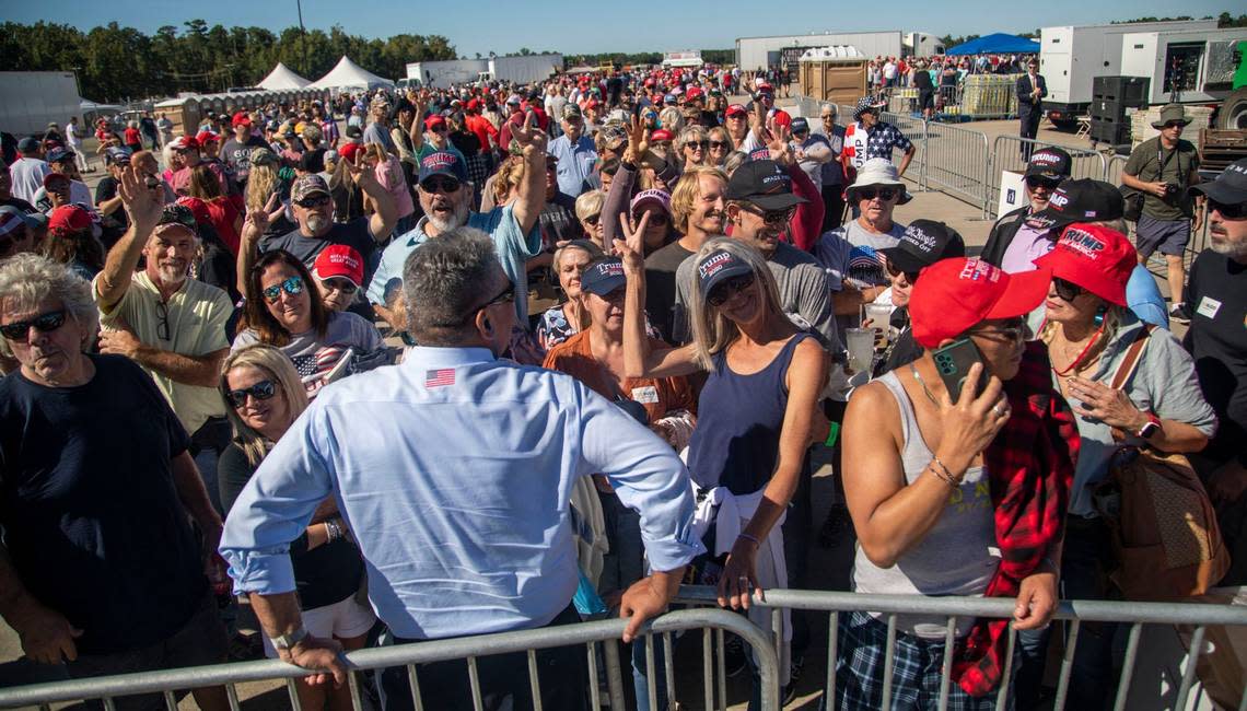 Supporters wait to gain entry to a GOP rally featuring former president Donald Trump, at Wilmington International Airport Friday, Sept. 23, 2022.