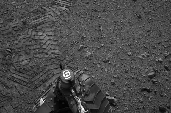 Tracks from the Mars rover Curiosity's first test drive include the name of its maker, "JPL" spelled out in Morse code.