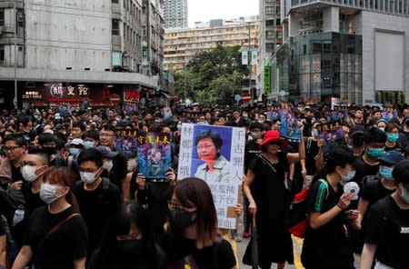 Anti-extradition bill protesters march at Mongkok, in Hong Kong