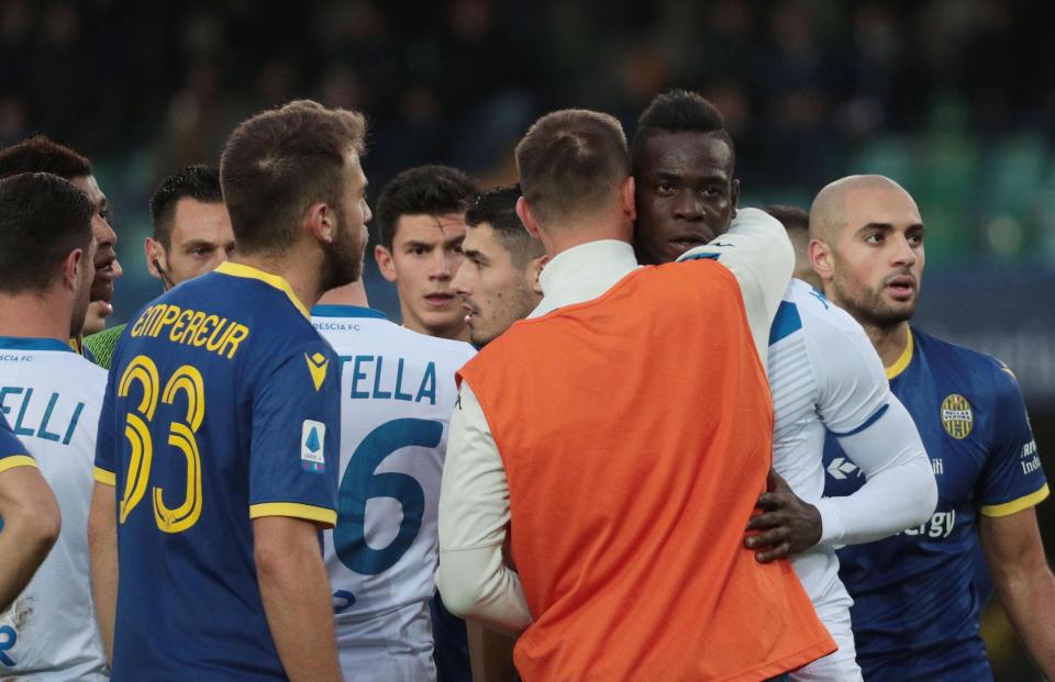 Brescia's Mario Balotelli, second from right, reacts to Verona supporters' racist chants during the Italian Serie A soccer match between Verona and Brescia at the Bentegodi stadium in Verona, Italy, Sunday, Nov. 3, 2019. (Simone Venezia/ANSA via AP)