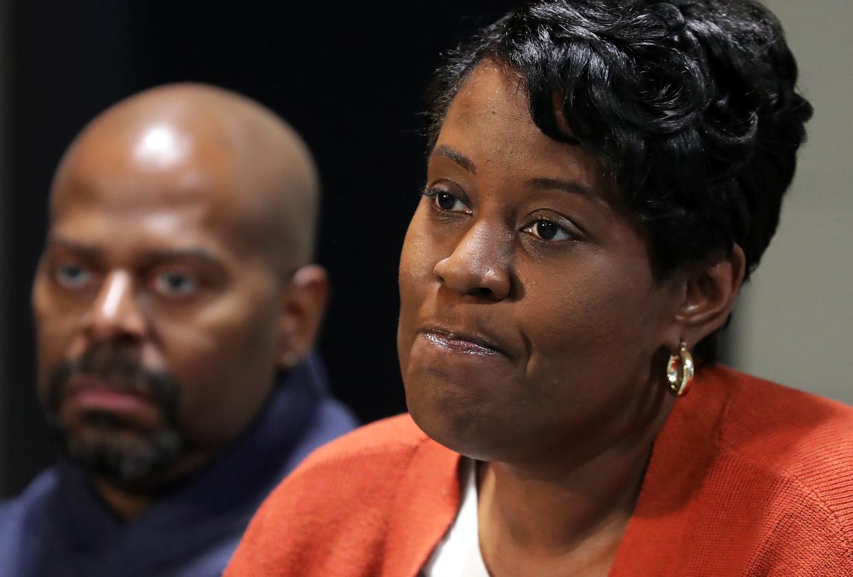 Alexandra Thomas, right, pauses for a moment as she talks about her daughter, Jalisa Buchanan, as her husband Damon Thomas Sr. looks on Tuesday at The House of the Lord in Akron. Buchanan was killed in an accidental shooting last week.