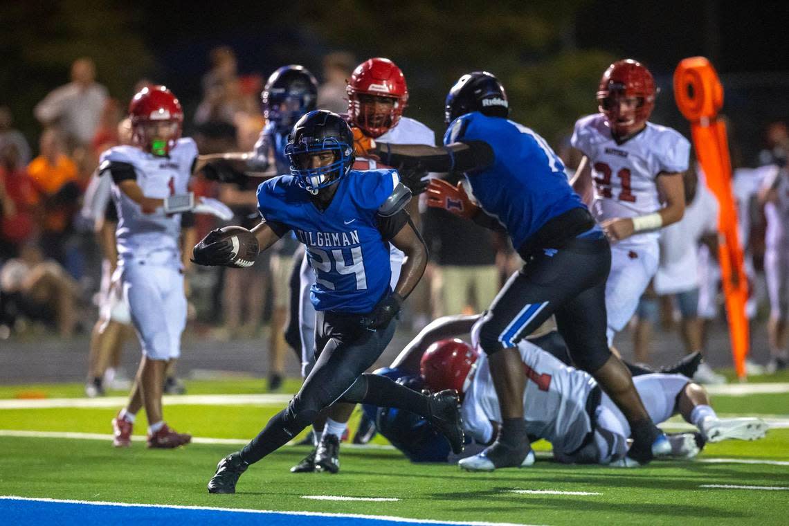 Paducah Tilghman’s Demarkus Wilson (24) scores a touchdown against Mayfield in the Blue Tornado’s 35-28 win at Ralph McRight Field in Paducah on Friday.