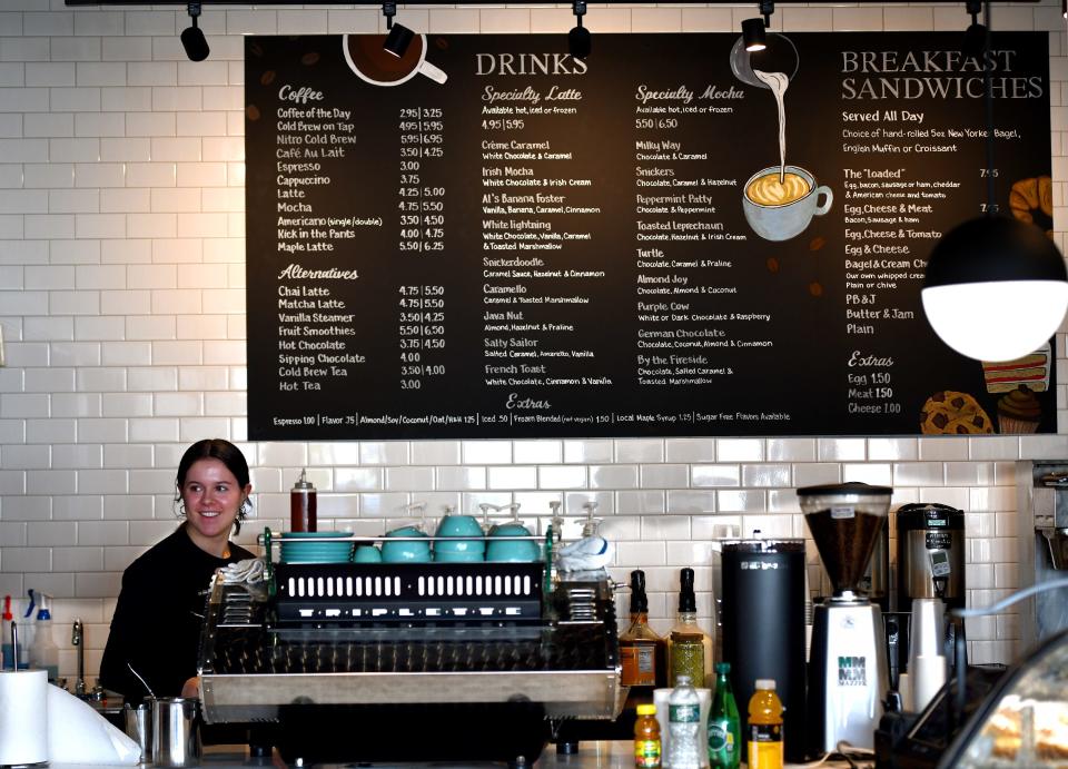 Barista and WPI sophomore Hana Premyslovsky of Rochester, New York, works behind the counter at Bean Counter Bakery's renovated Highland Street location.