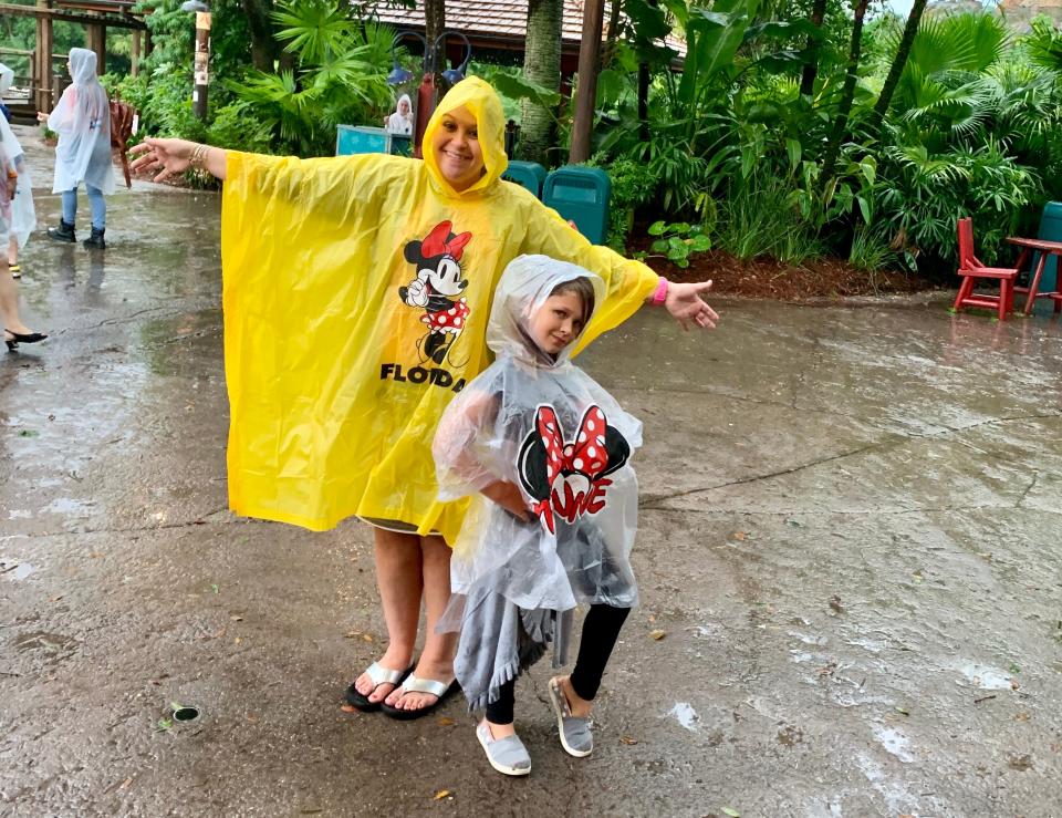 The author in a rain poncho at Disney.