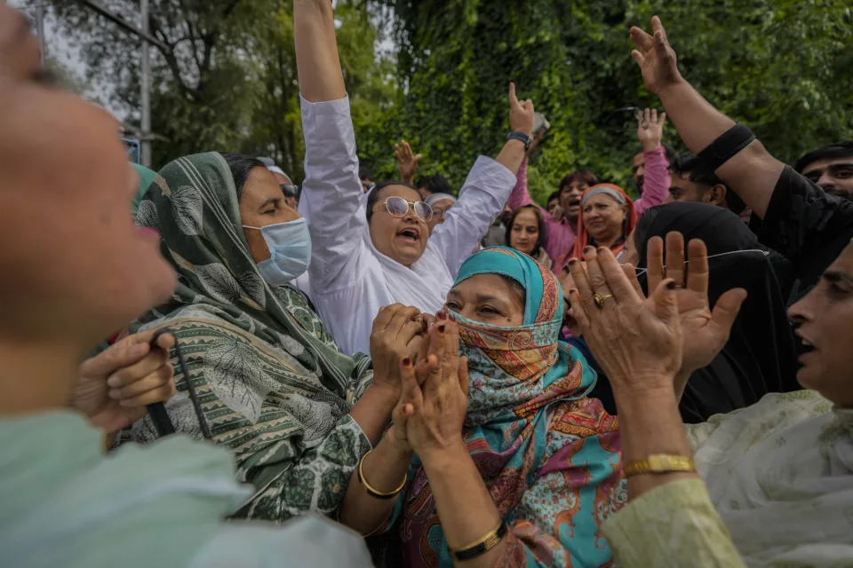 Supporters of Indian National Congress and National Conference party shout slogans as they celebrate early leads in election outside the counting center on the outskirts of Srinagar, Indian controlled Kashmir, Tuesday, Oct. 8, 2024. (AP Photo/Mukhtar Khan)