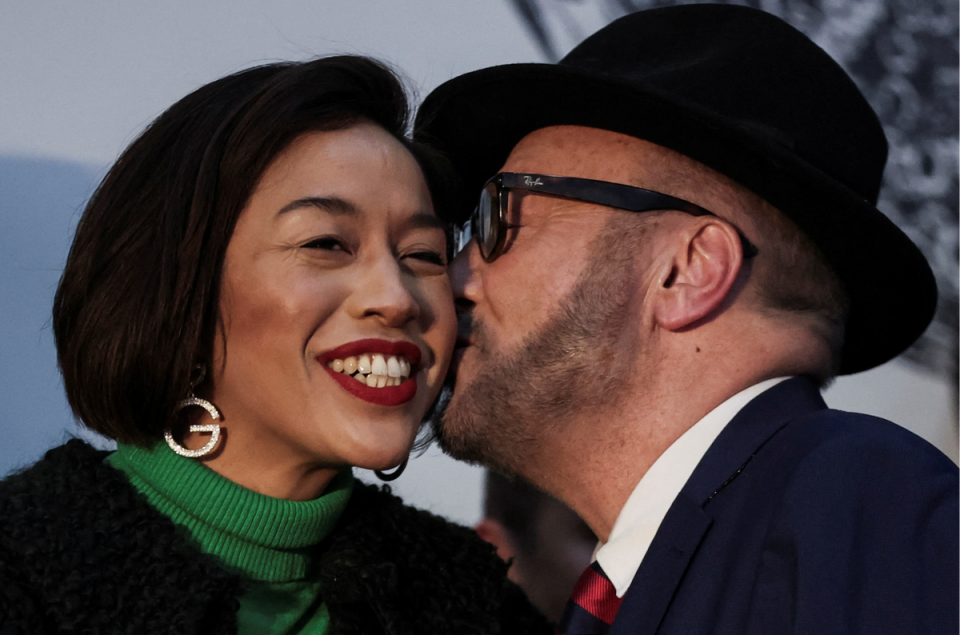 Galloway kisses his wife Putri Gayatri Pertiwi (REUTERS)