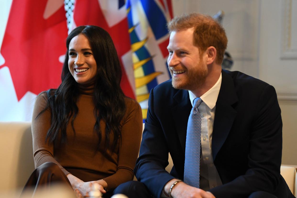 Britain's Prince Harry, Duke of Sussex and Meghan, Duchess of Sussex react during their visit to Canada House in thanks for the warm Canadian hospitality and support they received during their recent stay in Canada,  in London on January 7, 2020. (Photo by DANIEL LEAL-OLIVAS / POOL / AFP) (Photo by DANIEL LEAL-OLIVAS/POOL/AFP via Getty Images)