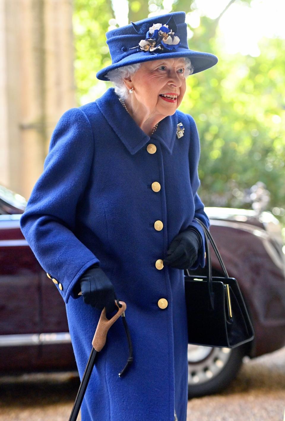 Queen Elizabeth II seen using a walking stick as she arrives for a Service of Thanksgiving to mark the centenary of The Royal British Legion at Westminster Abbey on October 12, 2021 in London, England