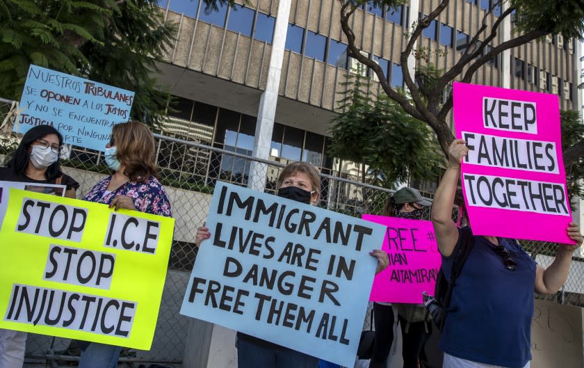 LOS ANGELES, CA - SEPTEMBER 30: Family members and supporters of detainees at the Adelanto Immigration Detention Center hold signs in front of the Los Angeles Federal Building during a news conference to begin a hunger strike protesting the alleged ``horrific and scary'' conditions in the facility on Wednesday, Sept. 30, 2020 in Los Angeles, CA. (Brian van der Brug / Los Angeles Times)