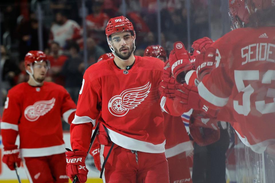 Detroit Red Wings center Joe Veleno (90) receives congratulations from teammates after scoring in the first period against the New York Rangers at Little Caesars Arena in Detroit on Thursday, Nov. 10, 2022.