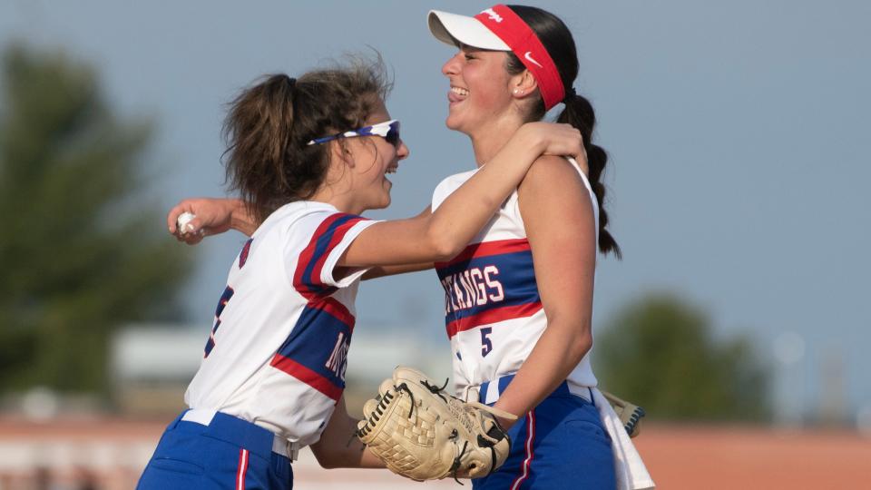 Triton's Danielle Procopio, right, hugs teammate Riley Mikiewicz after Triton defeated Timber Creek, 8-5, in the softball game played at Triton High School on Wednesday, April 5, 2023.