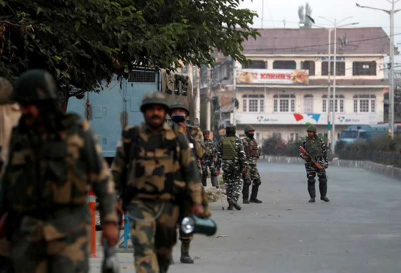 Indian security force personnel patrol near the residence of Syed Ali Shah Geelani after his death in Srinagar