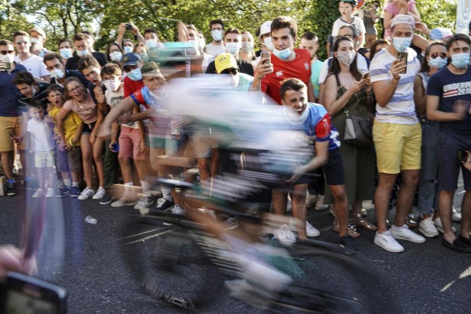 Spectators encourage cyclists during the 14th stage between Clermont-Ferrand and Lyon.