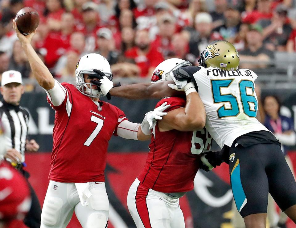 Blaine Gabbert, who played for the Jaguars from 2011-2013, throws a pass under pressure from the Jags' Dante Fowler in a 2017 game in Glendale, Ariz. Gabbert led two fourth-quarter scoring drives to beat the Jaguars 27-24 in that game.