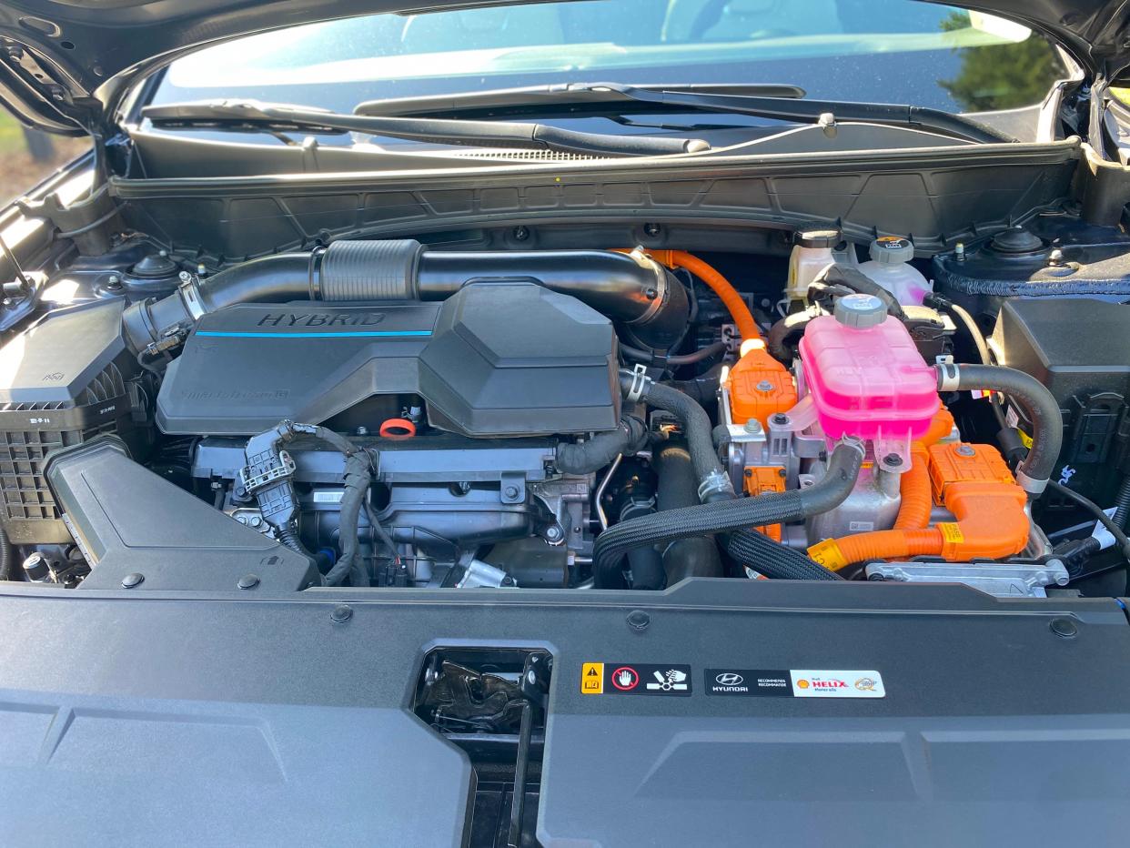 The 2024 Hyundai Tucson Hybrid's engine compartment with a 1.6-liter turbocharged, four-cylinder engine.