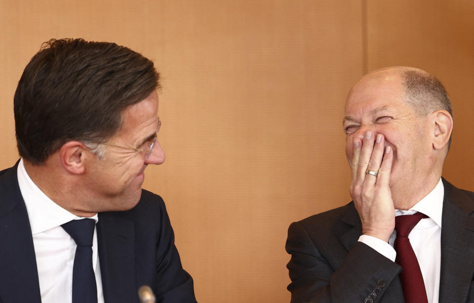 German Chancellor Olaf Scholz and Mark Rutte, Prime Minister of the Netherlands, left, attend a joint meeting of the Climate Cabinet at the Chancellery in Berlin, Germany, Tuesday, Oct. 4, 2022. (Lisi Niesner/Pool via AP)