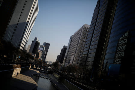 A man walks along the Cheonggye stream in central Seoul, South Korea January 25, 2017. REUTERS/Kim Hong-Ji/Files