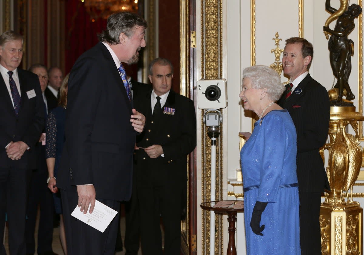 Stephen Fry meets the Queen at Buckingham Palace (PA) (PA Archive)