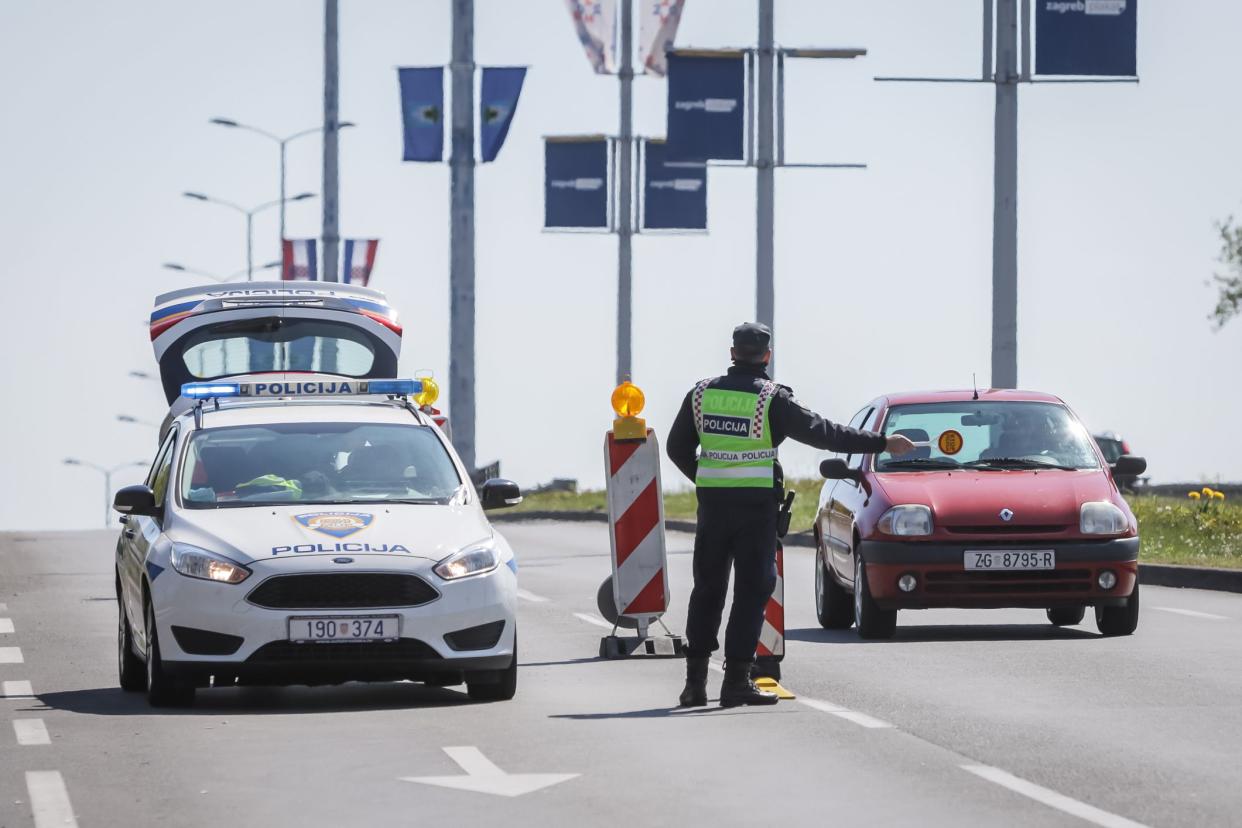 Zagreb, Croatia - 15 April, 2020 : Police stop cars to check passes between cities on the streets of Zagreb, Croatia, due to coronavirus restrictions.