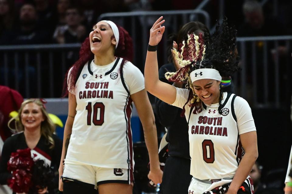 South Carolina's Kamilla Cardoso (10) and Te-Hina Paopao (0) react on the bench against NC State in the semifinals of the women's 2024 NCAA Tournament on Friday in Cleveland.