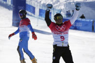 Victor Wild, of the Russian Olympic Committee, reacts after winning a bronze medal in the men's parallel giant slalom at the 2022 Winter Olympics, Tuesday, Feb. 8, 2022, in Zhangjiakou, China. (AP Photo/Gregory Bull)