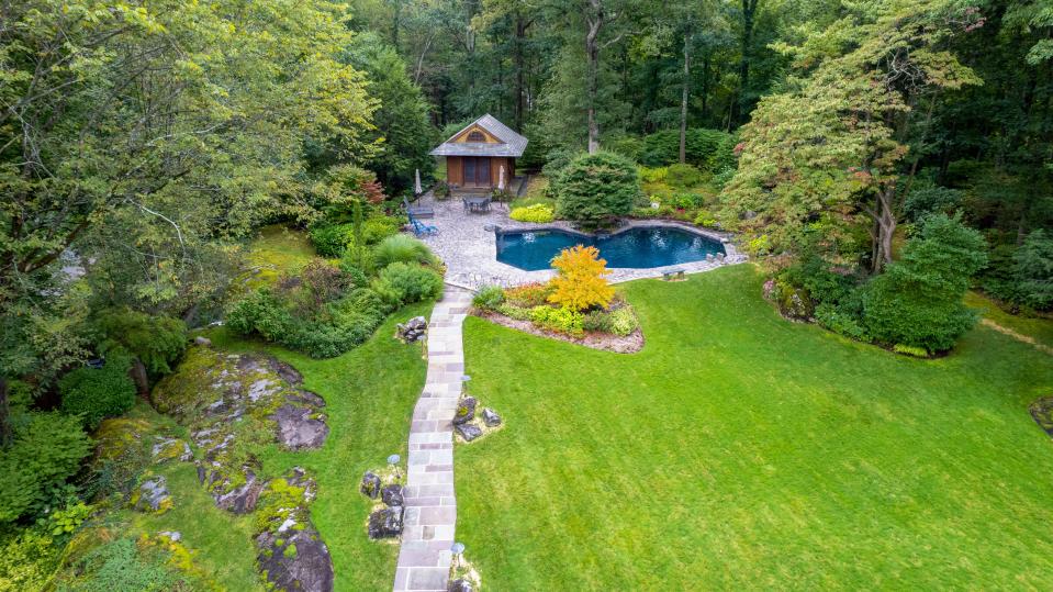 This four-bedroom contemporary in the Sterling Ridge section of Harrison features grounds designed by the landscape architect Armand Benedek in 1970 and then reshaped by another talented landscape designer who bought the property in 2004.