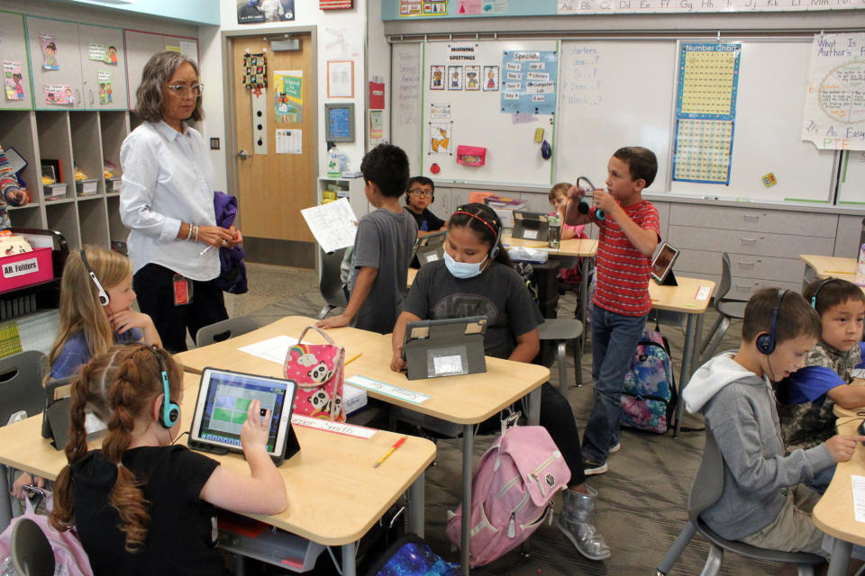 Teacher Arleen Franklin and her second-grade class prepare to line up for lunch at Judy Nelson Elementary School, Sept. 21, 2022, in Kirkland, N.M. Franklin and other teachers say the closure of the nearby San Juan Generating Station and an adjacent mine already has resulted in the school losing students as some families have been forced to move away in search for new employment. (AP Photo/Susan Montoya Bryan)