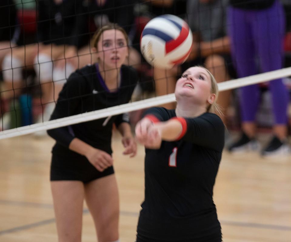 Thurston's Emily Buller returns a shot against Ridgeview in a volleyball match at home.