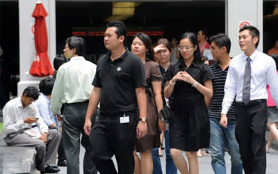 MOM tightens the employment pass criteria to ensure Singaporeans remain at the core of a diverse and globally competitive workforce. (AFP file photo)