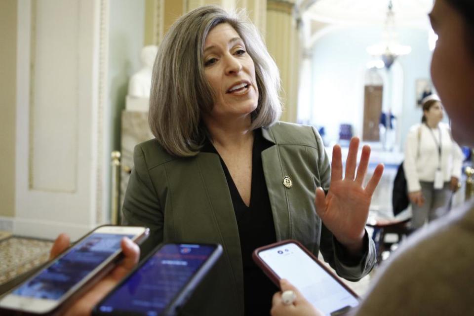 Joni Ernst talks to the media at the Capitol on Thursday.