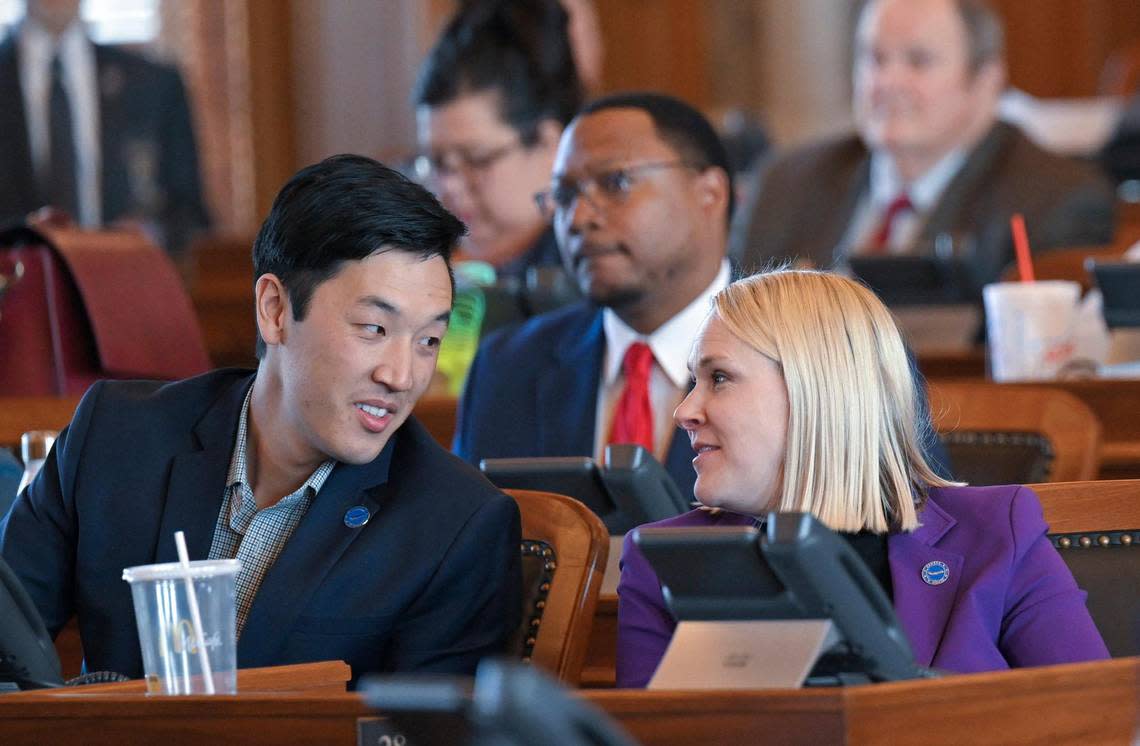 Rep. Rui Xu, left, a Democrat from Westwood, talks with Rep. Jo Ella Hoye, a Democrat from Lenexa, as a special education bill was debated in the Kansas House.