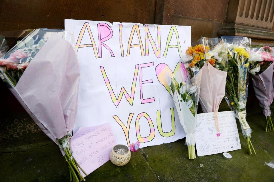 Tributes left at the scene (PA)