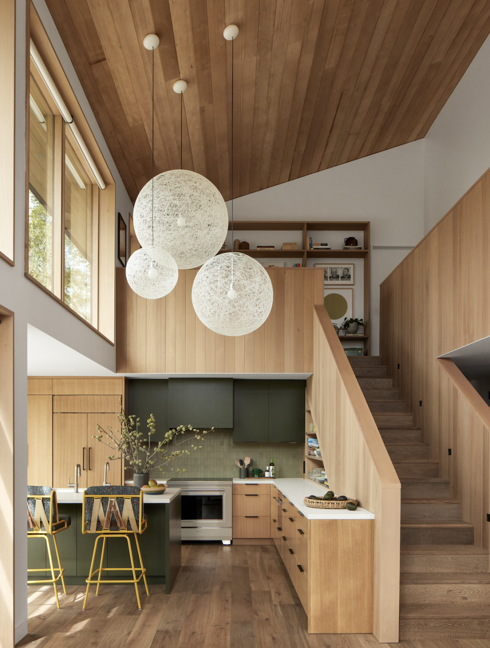 a kitchen with a staircase and a staircase