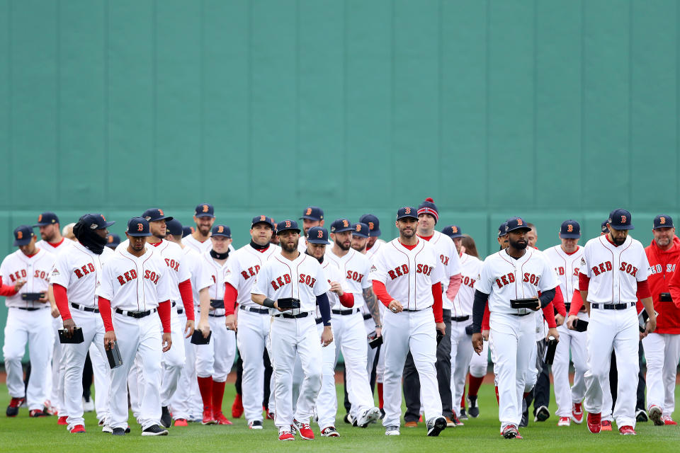 BOSTON, MASSACHUSETTS - APRIL 09: The Boston Red Sox walk towards their dugout after raising the 2018 World Series Championshihp banner before the Red Sox home opening game against the Toronto Blue Jays at Fenway Park on April 09, 2019 in Boston, Massachusetts. (Photo by Maddie Meyer/Getty Images) Guillermo Martinez #16 of the Toronto Blue Jays