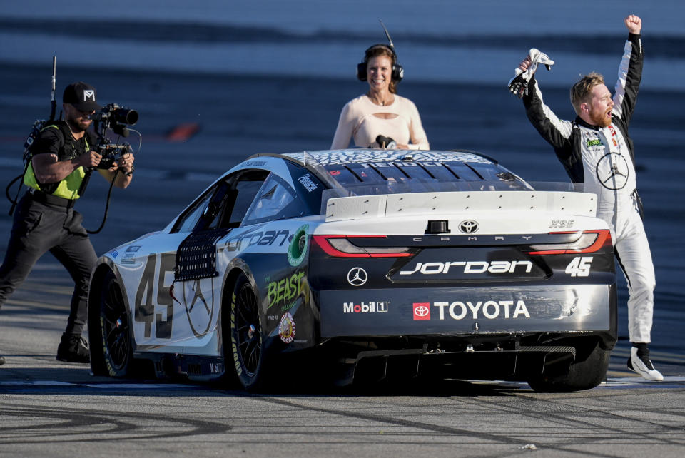 Tyler Reddick celebrates his win after a NASCAR Cup Series auto race at Talladega Superspeedway, Sunday, April 21, 2024, in Talladega. Ala. (AP Photo/Mike Stewart)