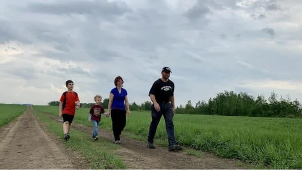 Sébastien Grondin walks with his family on the land, Ferme Valsé in the Pintendre sector of Lévis, Que.