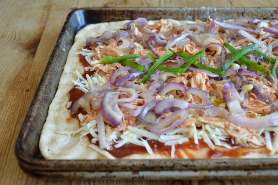 <p>If you're short on time but still want to get creative in the kitchen, make this flatbread. It's loaded with peppers, onions and chicken and topped off with barbecue sauce. Picky eaters can choose their own toppings.</p> <p><a href="https://www.thedailymeal.com/best-recipes/bbq-chicken-flatbread-homemade-recipe?referrer=yahoo&category=beauty_food&include_utm=1&utm_medium=referral&utm_source=yahoo&utm_campaign=feed" rel="nofollow noopener" target="_blank" data-ylk="slk:For the BBQ Chicken Flatbread recipe, click here.;elm:context_link;itc:0;sec:content-canvas" class="link ">For the BBQ Chicken Flatbread recipe, click here.</a></p>