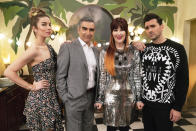 This image released by Pop TV shows, from left, Annie Murphy, Eugene Levy, Catherine O'Hara and Dan Levy from the series "Schitt's Creek." The series won the award for best television series, musical or comedy at the Golden Globe Awards on Sunday, Feb. 28, 2021. (Pop TV via AP)