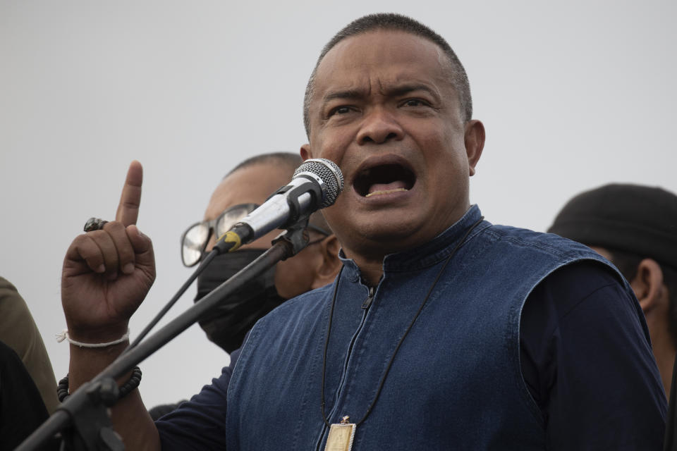 Jatuporn Prompan, leader of the United People for Thailand political group, speaks during a pro-democracy demonstration in Bangkok, Thailand, Thursday, June 24, 2021. Pro-democracy demonstrators have taken to the streets of Thailand's capital again, marking the 89th anniversary of the overthrow of the country's absolute monarchy by renewing their demands that the government step down, the constitution be amended and the monarchy become more accountable. (AP Photo/Wason Wanichakorn)