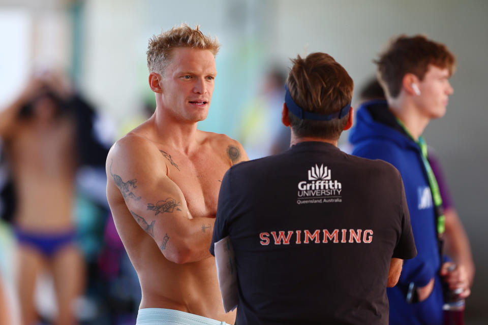 GOLD COAST, AUSTRALIA - APRIL 20: Cody Simpson speaks with coach Michael Bohl during the 2024 Australian Open Swimming Championships at Gold Coast Aquatic Centre on April 20, 2024 in Gold Coast, Australia. (Photo by Chris Hyde/Getty Images)