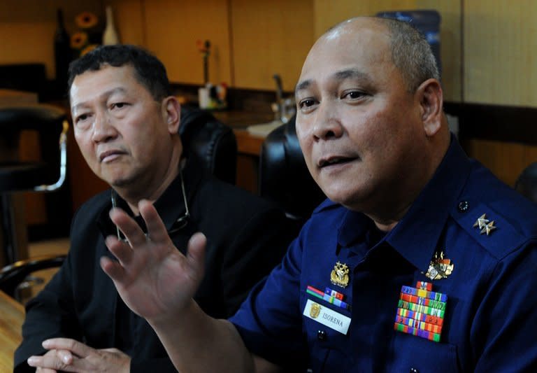 Philippine coastguard chief Rear Admiral Rodolfo Isorena (R) and Asis Perez, Bureau of Fisheries and Aquatic Resources chief, are pictured in Manila on May 10, 2013. The Philippine coastguard admitted Friday that its personnel shot at a Taiwanese fishing boat in an incident that authorities in Taipei said left a crewman dead