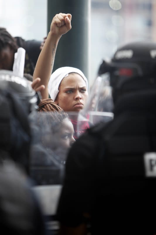 <p>Protestors face police near the Bank of America during the game between the Minnesota Vikings and the Carolina Panthers. Mandatory Credit: Angela Wilhelm/Citizen-Times via USA TODAY NETWORK </p>