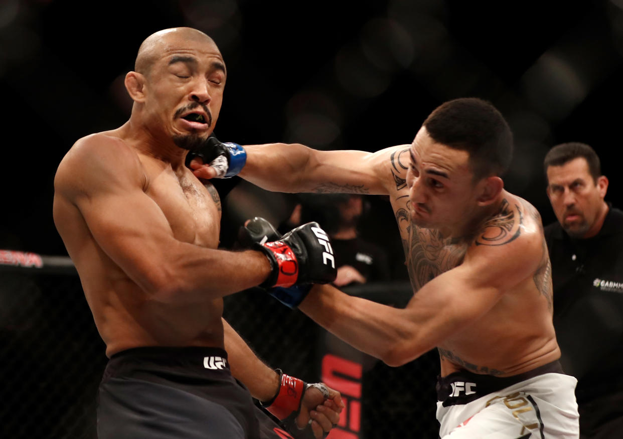 RIO DE JANEIRO, BRAZIL - JUNE 03:  (R-L) Max Holloway punches Jose Aldo of Brazil in their UFC featherweight championship bout during the UFC 212 event at Jeunesse Arena on June 3, 2017 in Rio de Janeiro, Brazil. (Photo by Buda Mendes/Zuffa LLC/Zuffa LLC via Getty Images)