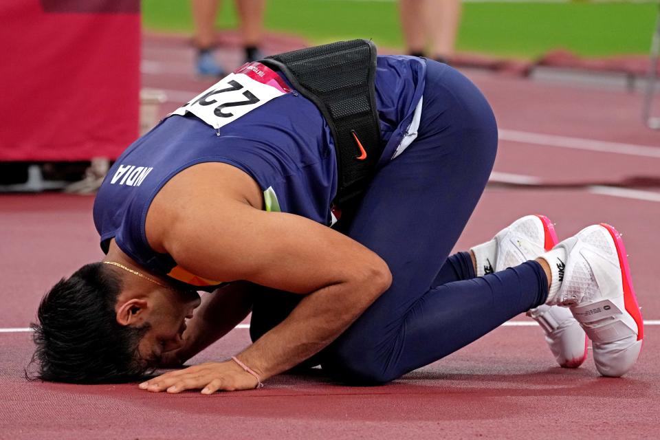 Aug 7, 2021; Tokyo, Japan; Neeraj Chopra (IND) celebrates winning the gold medal in the men's javelin throw final during the Tokyo 2020 Olympic Summer Games at Olympic Stadium. Mandatory Credit: Kirby Lee-USA TODAY Sports